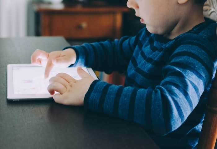 A child learning on a tablet