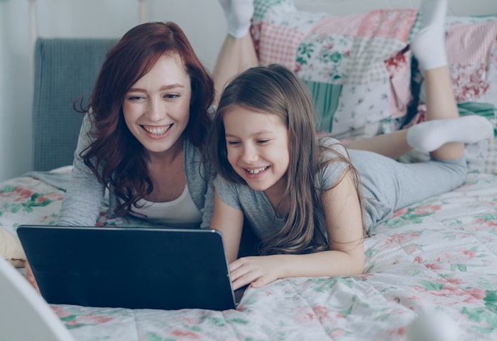 A parent and child celebrating progress